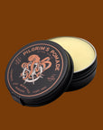 A round tin of solid hair pomade with an illustration of an octopus on the lid and text that reads, 'Pilgram's Pomade Light - Medium Hold'.