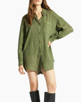 A green linen shirtdress button up with long sleeves.