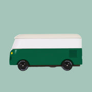 A green and white wooden VW bus toy.