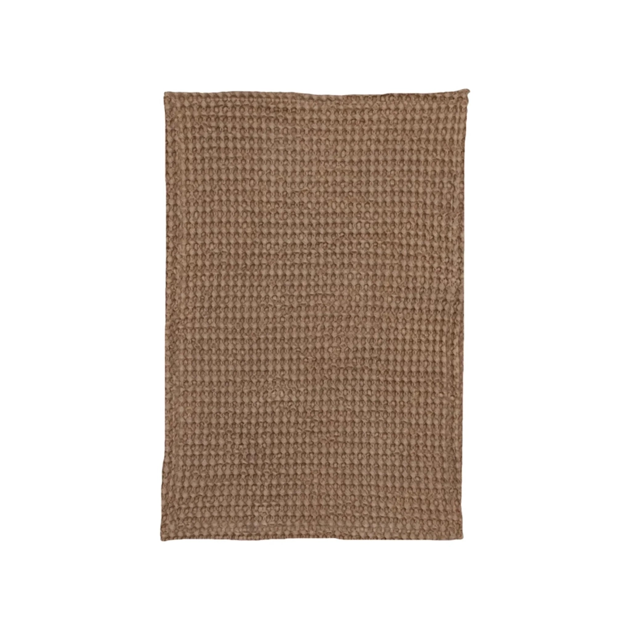 On a white background is a waffle knit brown tea towel. 