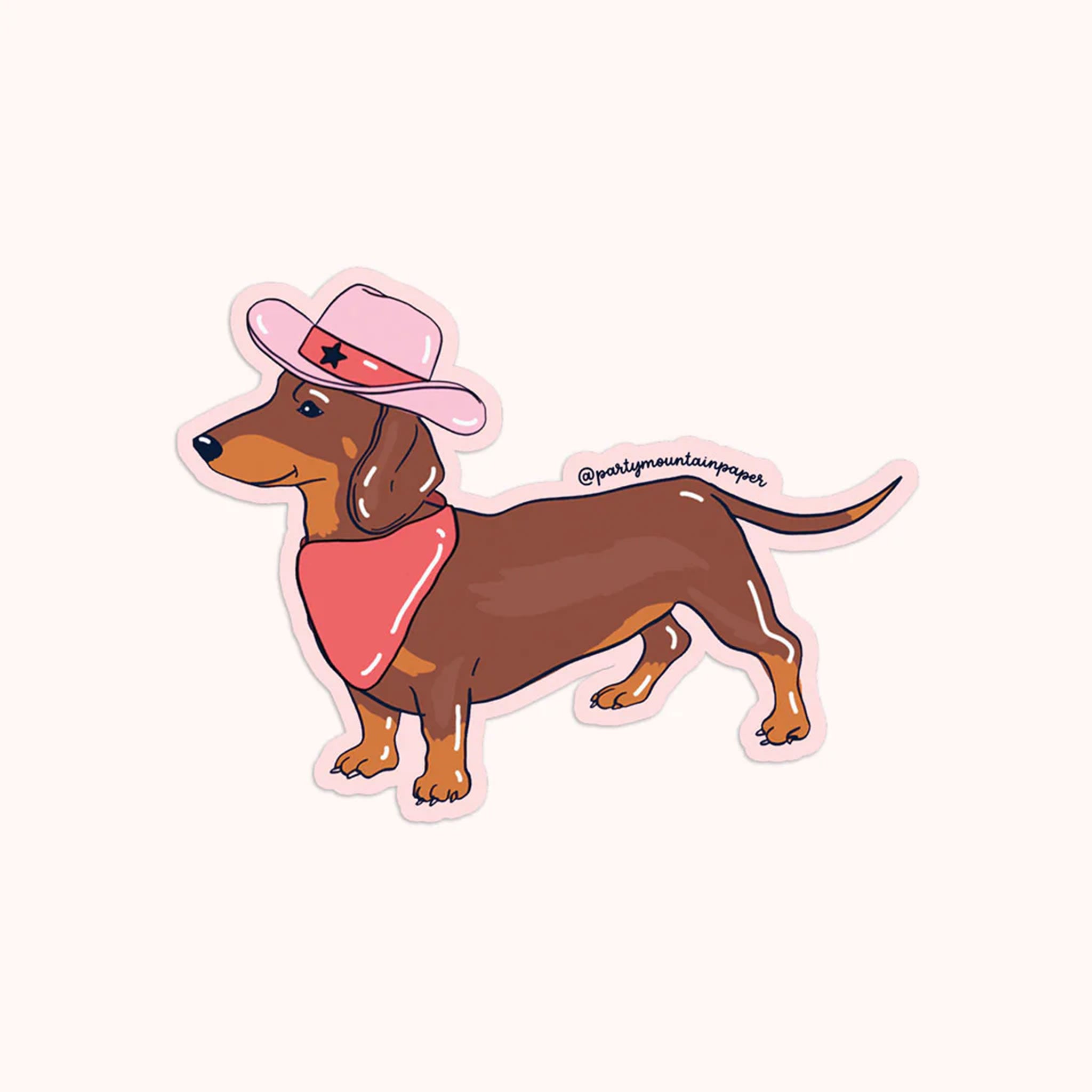 On a neutral background is a weenie dog sticker with a bandana and pink cowboy hat on. 