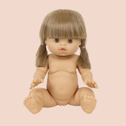 Little girl baby doll with short blonde hair, bangs and light blue eyes.