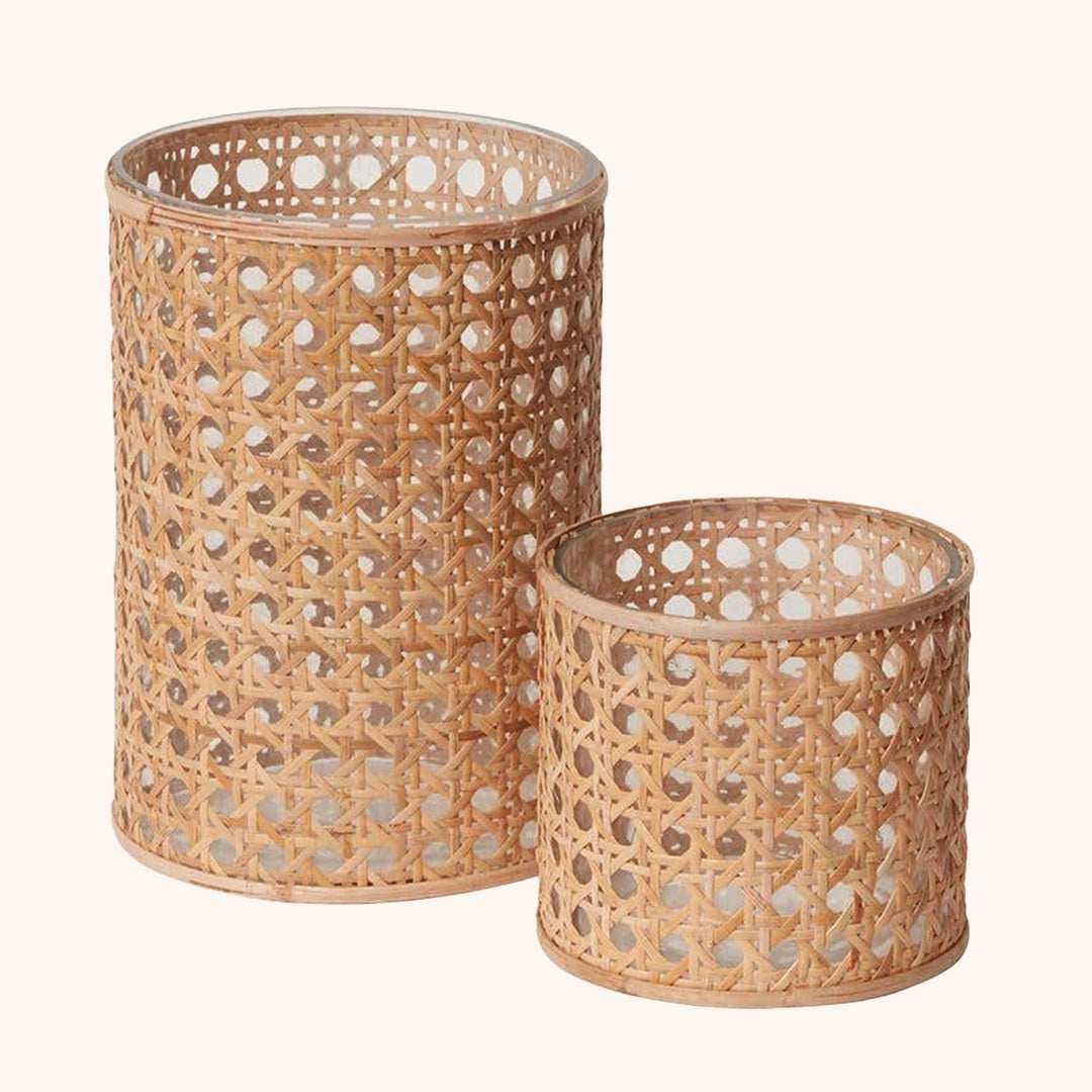 On a white background is a cane wrapped votives  in two different sizes. 