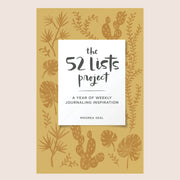 A mustard yellow journal with darker yellow illustrations of various palms, leaves and cacti along with a white rectangle in the center with black text that reads, "the 52 lists project", "A Year of Weekly Journaling Inspiration".