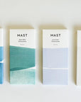 A photograph of other Mast Chocolate bars available including the Oat Milk, Sea Salt, and Tea flavor.
