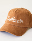 A burnt orange corduroy baseball hat with "California" written on the front along with an adjustable snapback feature.