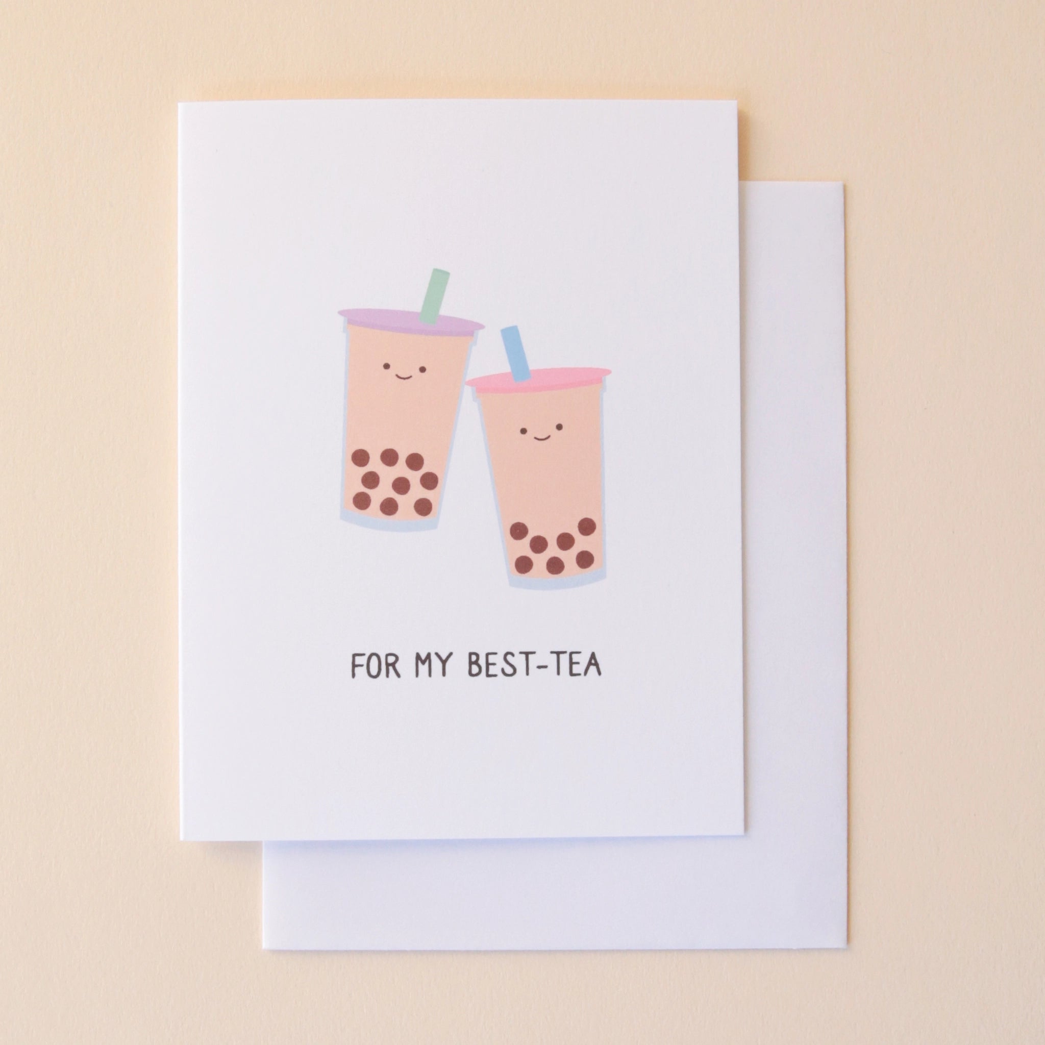 A white card with illustrations of two bubble teas, both with smiling faces and text underneath that reads, "For My Best-Tea" in black letters.