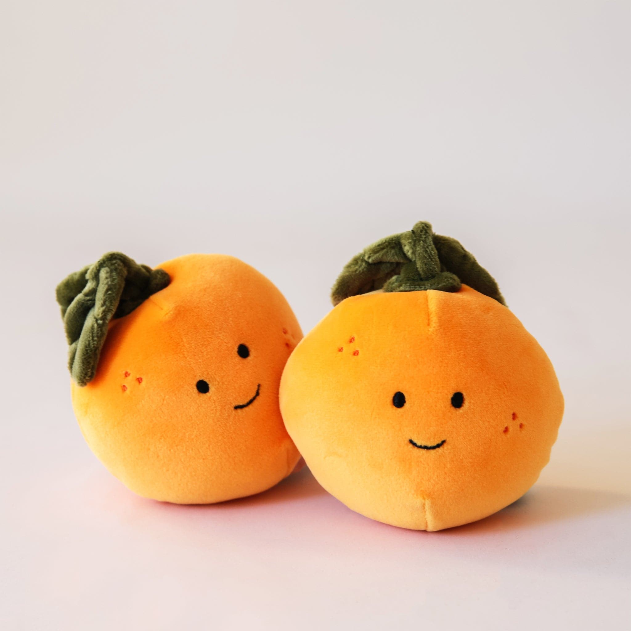 Adorable, plush oranges with sweet smiles and speckled cheeks. With floppy green leaves, these oranges are the absolute cutest. Their fur is soft and their leaves are floppy.