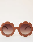 Brown flower shaped sunglasses with light brown circle lenses in the center.