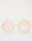 White flower sunglasses with a pink lens.