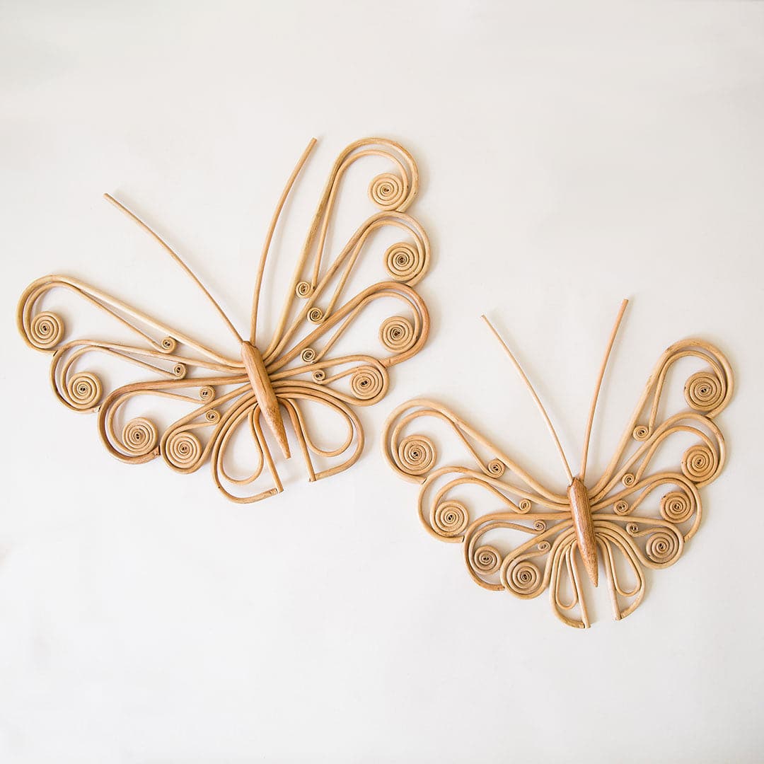 Two different sized rattan shaped butterfly wall art with curled wings.
