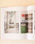 A page open in the book that features a photograph of a beautifully designed kitchen with greenery.