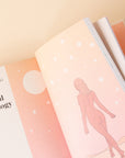 A peek inside the book, this page has an illustration of a nude woman walking away created with shades of orange a pinks.
