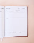 A look inside the recipe book featuring handy cooking guide charts for temperatures, volumes, weights and cup measures. Space for dietary requirements, serving size, difficulty as well as serving and pairing suggestions.