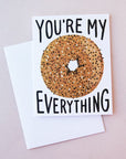 Idlewild Everything Bagel Folded Card - featuring a photograph of a white folded card with a graphic of an everything bagel along with "You're My Everything" in black text.