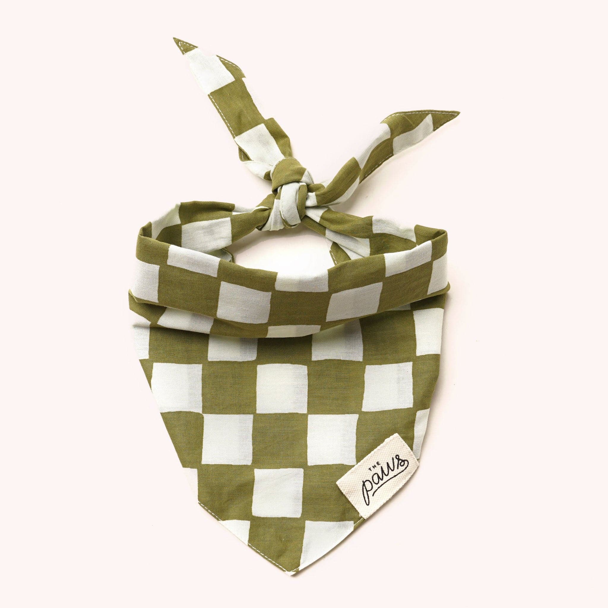 A white and green checker bandana for your furry friends. It features a tie backing.