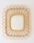 Rectangle shaped mirror with a piped rattan design.