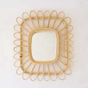 Rectangle shaped mirror with a piped rattan design. 