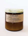 Candle features amber glass with a gold lid. The label is kraft paper with typewriter font that reads "No.21: Golden Coast Soy Candle Handmade in California with 100% Soy Wax. P.F. Candle Co."