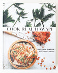 A white book cover with palm trees and a vibrant meal in a bowl along with with text that reads, "Cook Real Hawai'i".