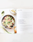 A look inside of the book that features a photograph of the meal and then the description and recipe on the next page.