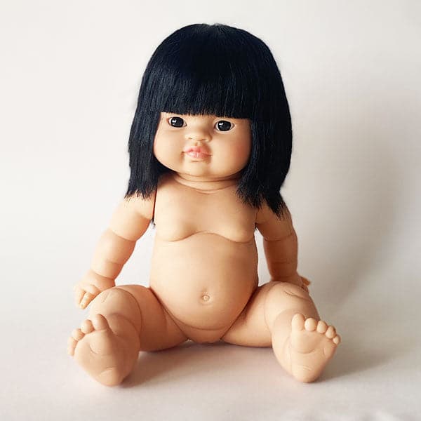 An asian baby doll with black straight hair and brown eyes. 