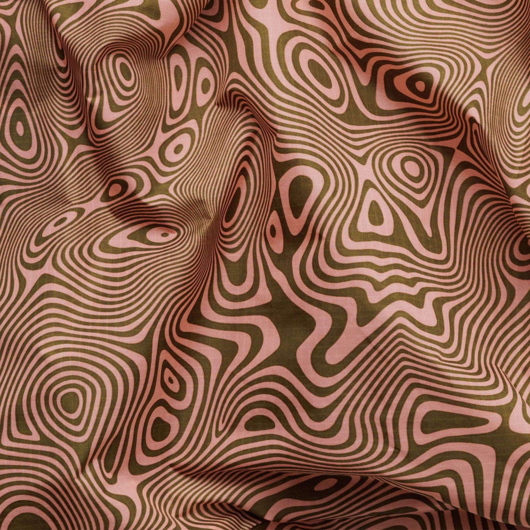 A nylon bag with an orange and cream wavy swirl pattern all over.