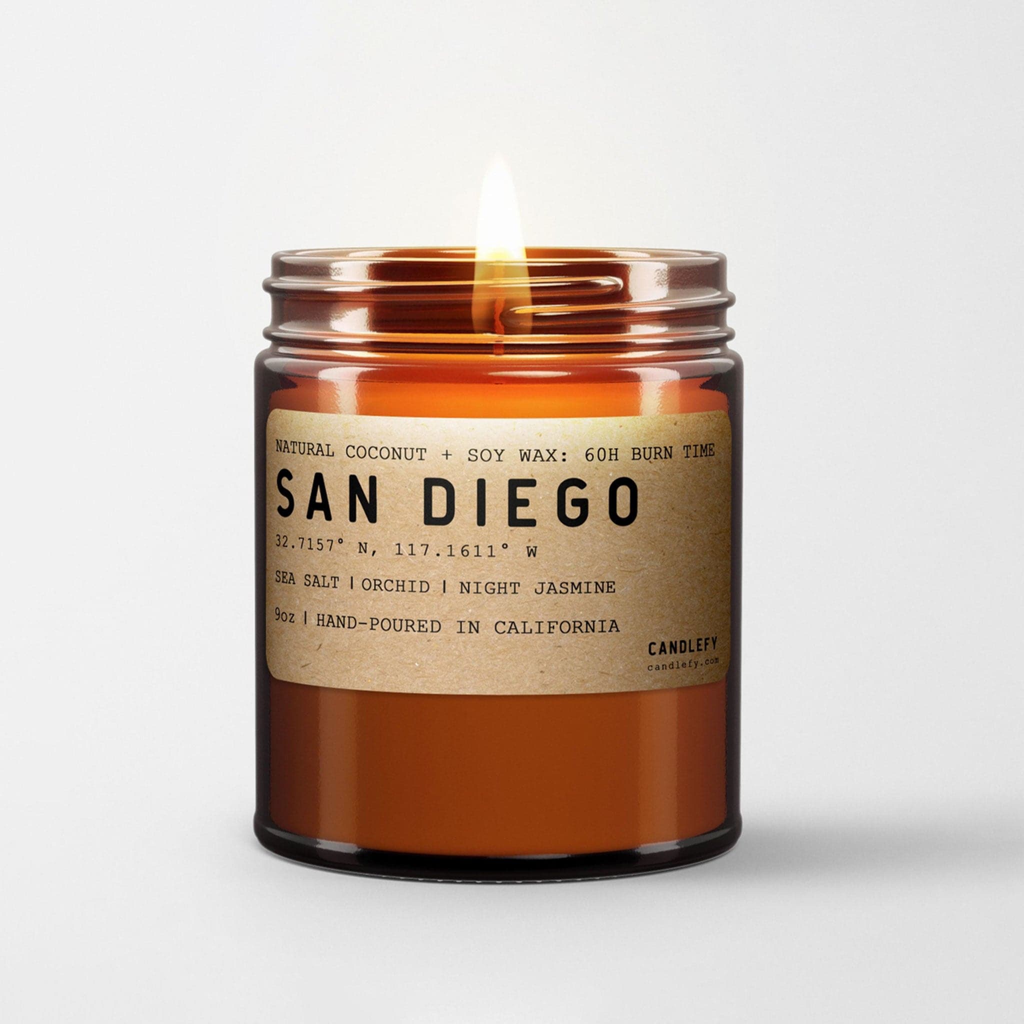 A glass amber jar with a natural colored label that reads, "San Diego" along with the details of the candle. This candle's scent is made of sea salt, orchid and night jasmine.