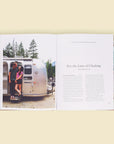 Two open pages of the book. The left page is filled with a lovely couple posed in front of their silver airstream trailer. The right page is titles 'For the Love of Climbing' and dives into the story of Gabi and Brandon Fox against a solid white page.