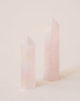 A rose quartz crystal with an iridescent quality to it.