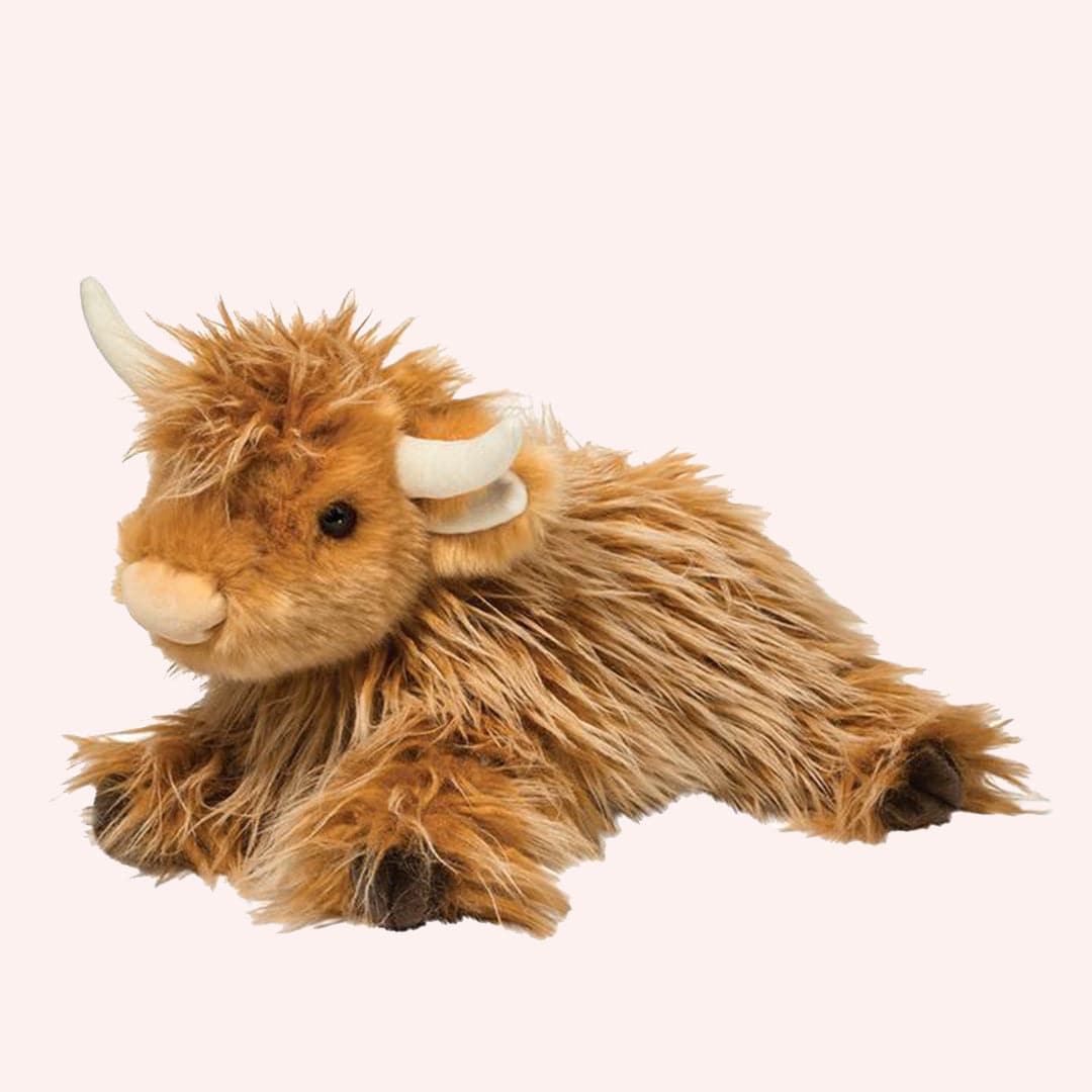 This charming highland cow boasts a ginger colored coat of tangly, super soft tan fur. Curved horns and large, dark eyes bring out Wallace’s personality, while brown cloven hooves detail his floppy, brown bean-filled feet.