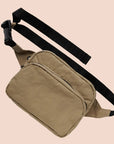 A dark khaki colored fanny pack with two zippers and a black adjustable strap.