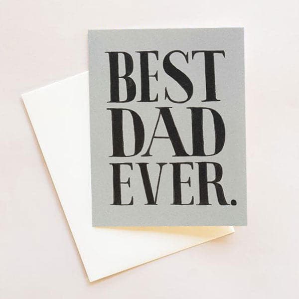 Grey greeting card with white envelope with large text covering the whole card, &quot;BEST DAD EVER.&quot;