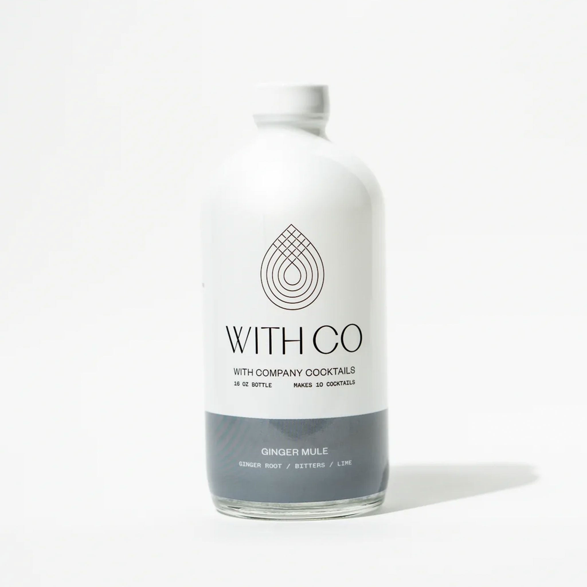 A white bottle of ginger mule cocktail mix with a grey bottom half and the brand &quot;With Co&quot; in black text across the center of the bottle.