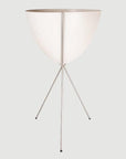 In front of a white background is a white colored bullet planter. The planter has a wide top and narrows at the bottom. The planter is held up by a silver metal stand. The stand has three silver metal legs.