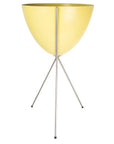 In front of a white background is a yellow colored bullet planter. The planter has a wide top and narrows at the bottom. The planter is held up by a silver metal stand. The stand has three silver metal legs.