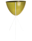 In front of a white background is an olive green colored bullet planter. The planter has a wide top and narrows at the bottom. The planter is held up by a white metal stand. The stand has three white metal legs.