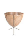 In front of white background is a wood colored planter in a short silver metal stand. The bullet planter is wide at the top and narrow at the bottom. The metal stand has three legs.
