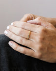 Delicate gold ring with etched suns and moons circling the band. Each sun and moon has a CZ gem in the center. This ring is perfect for stacking or wearing alone.