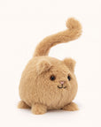 Soft stuffed animal in the shape of a round caramel colored cat with a question mark shaped tail.