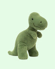 Soft stuffed animal in the shape of a green T-Rex.