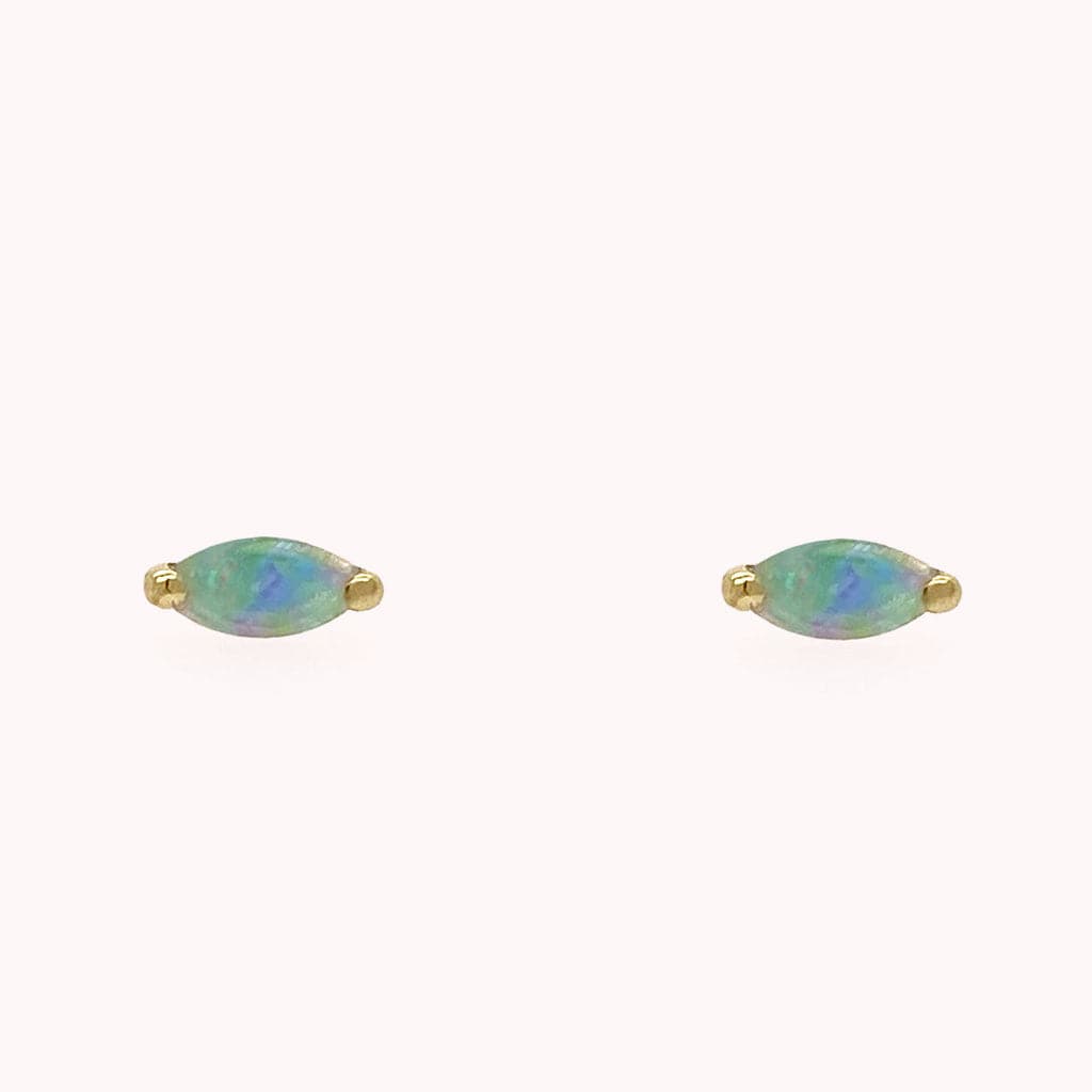 Opal oval stud earrings with gold detailing. 