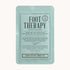 On a white background is a light blue packet with a foot mask inside along with text on the front that reads, "Foot Therapy".