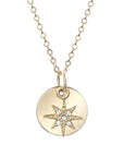 Long gold chain and circle gold pendant with crystal gemmed star charm.