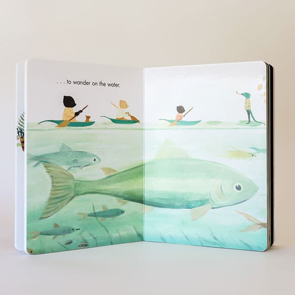 Two open pages of the book. Across the pages is the small animal family rowing along a soft aqua river. Below them swims an average sized school of fish looming below all three of them, providing some size reference. 
