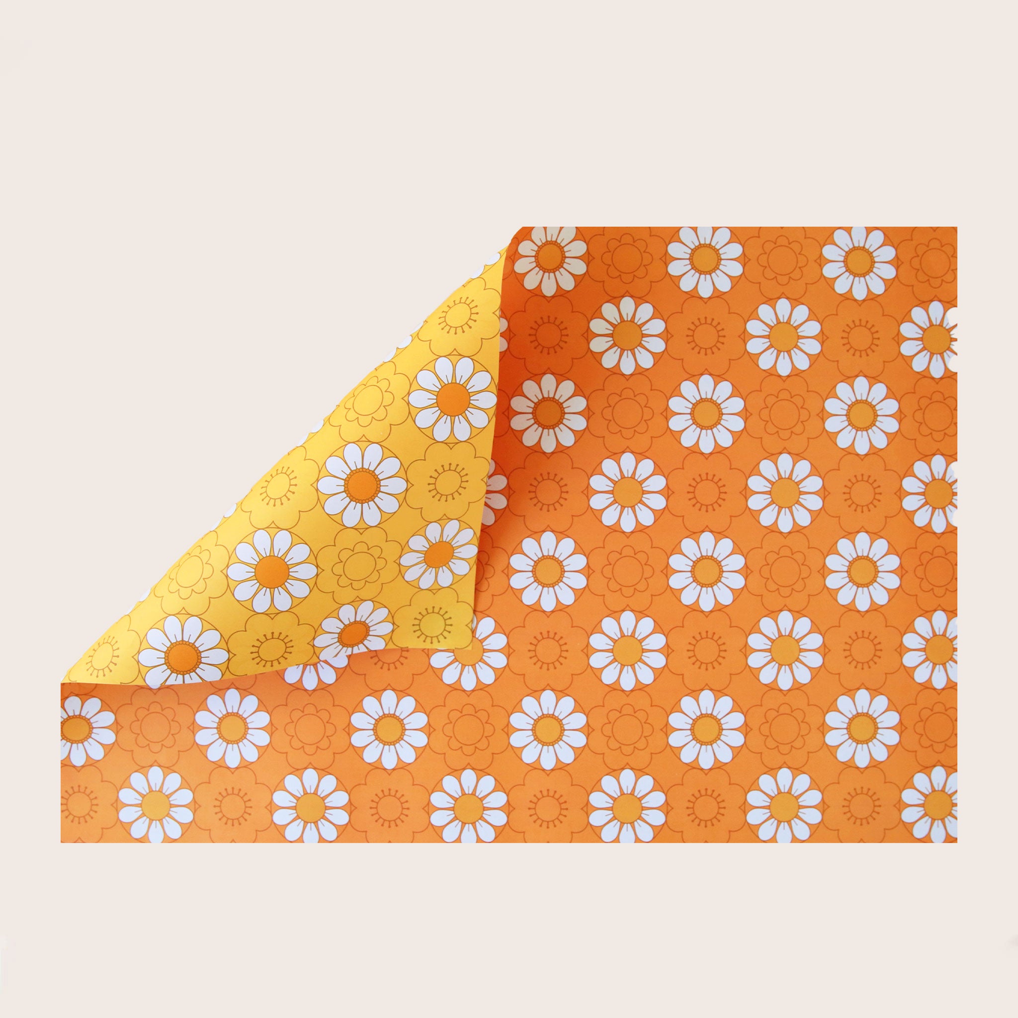 A wrapping paper with an orange base and a white and orange daisy pattern all over. 