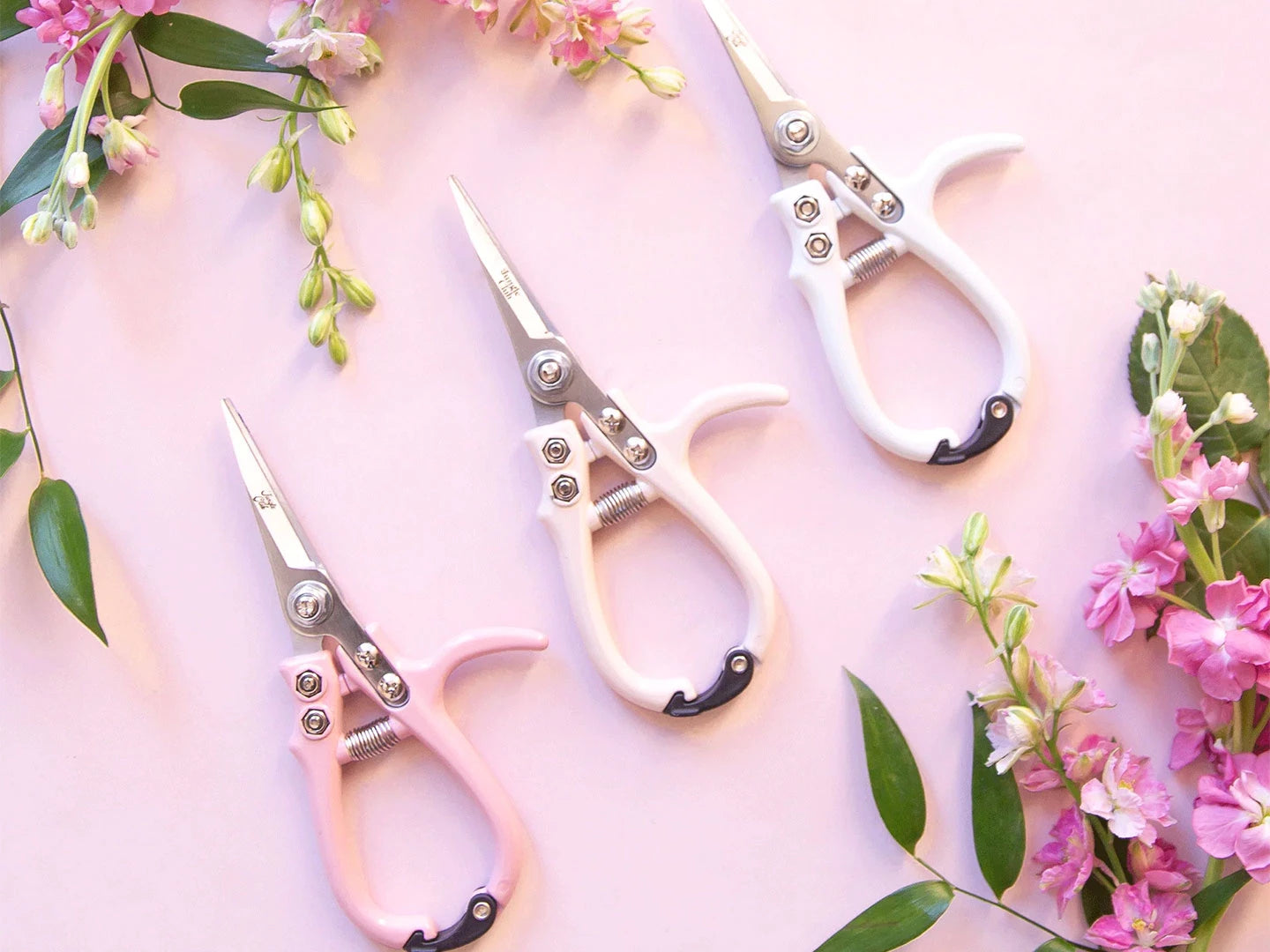 pruning shears in pink, vanilla, and white