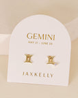gold earrings in the shape of the gemini zodiac sign