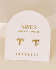 gold earrings in the shape of the aries zodiac sign