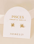 gold earrings in the shape of the pisces zodiac sign